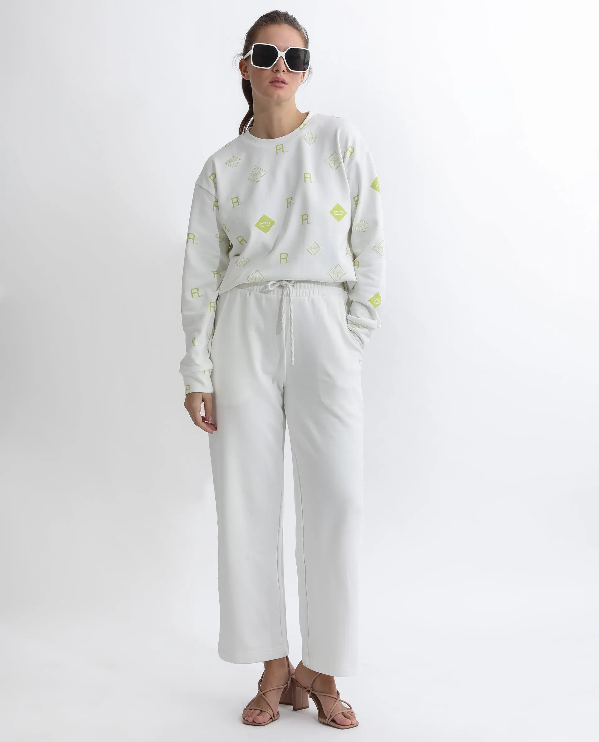 Rareism Women Pazoo T Off White Cotton Blend Fabric Flared Solid Mid Rise Ankle Length Track Pant